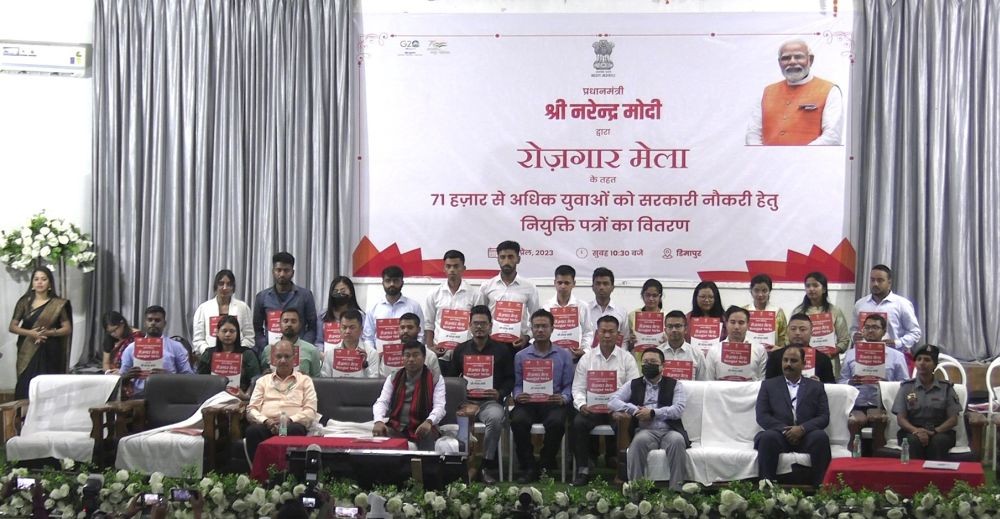 Minister Rameswar Teli with the meritorious candidates of the Rozgar Mela during the ceremony held at IMC hall, Dimapur on April 13. (Morung Photo)